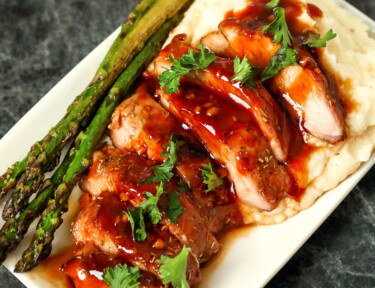 Plate with mashed potatoes and sliced pork tenderloin