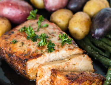 Slices of an air fryer pork chop on a plate