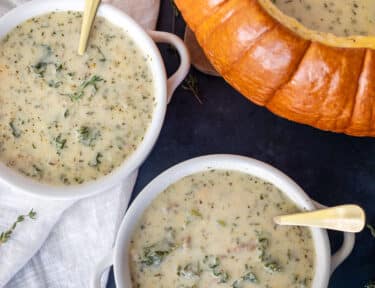 Bowls of Soup in a Pumpkin next to pumpkin.