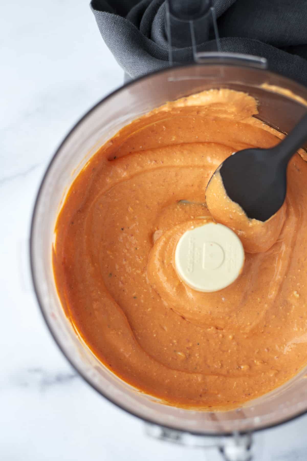 Roasted red pepper whipped feta in a food processor.