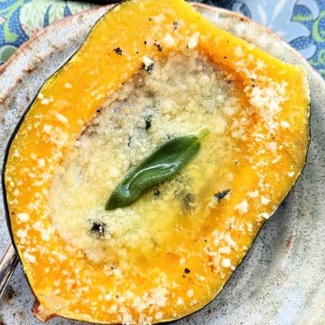 plated acorn squash flavored with butter, garlic, sage and Parmesan