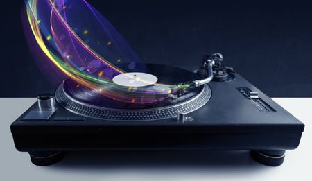 Turntable playing vinyl with glowing abstract lines concept on background