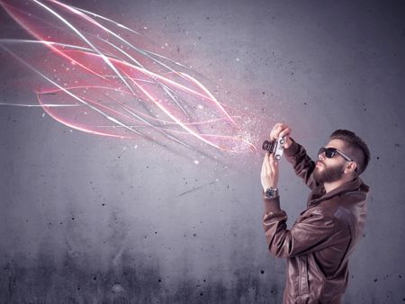 A stylish funny hipster person holding a vintage camera and taking photographs illustrated with glowing red, white lines concept