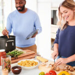 Man and Woman Cooking Healthy Food in a Kitchen