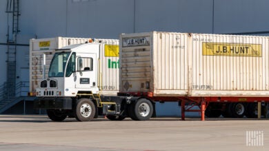 A yard truck moving JBI containers at a warehouse