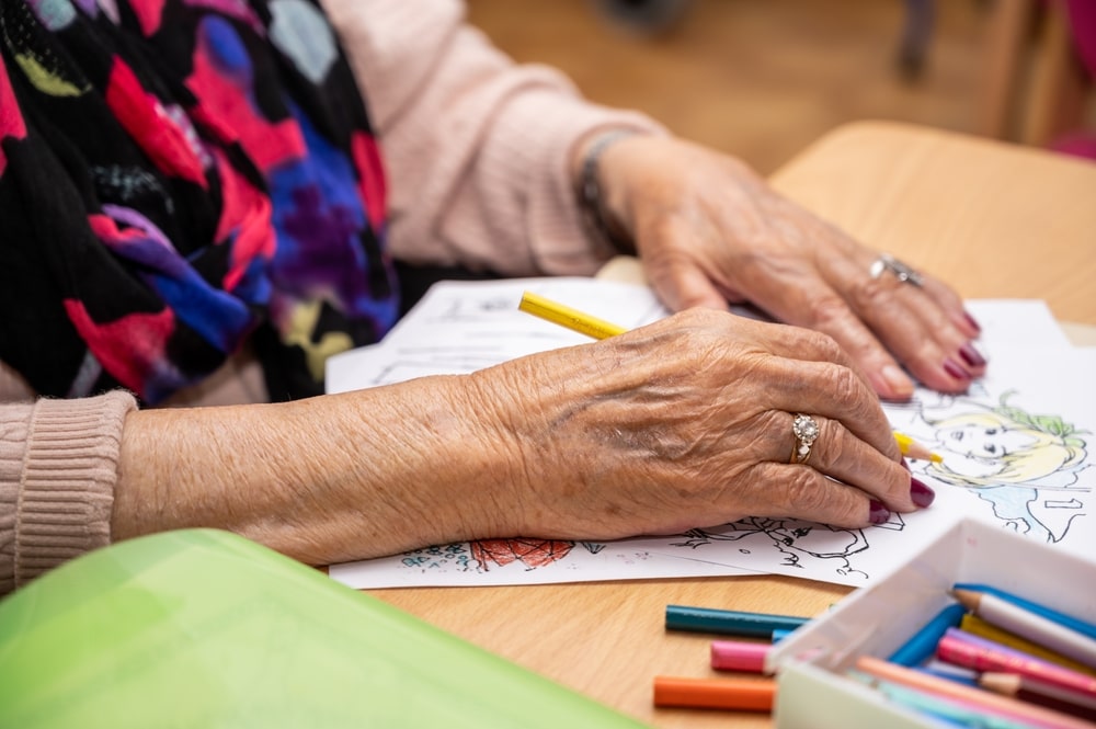 Older woman in hospice coloring