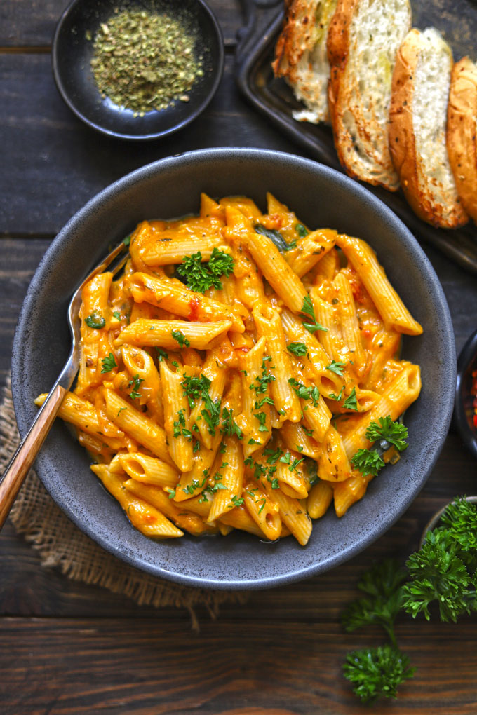 aerial shot of pumpkin pasta in a black ceramic bowl