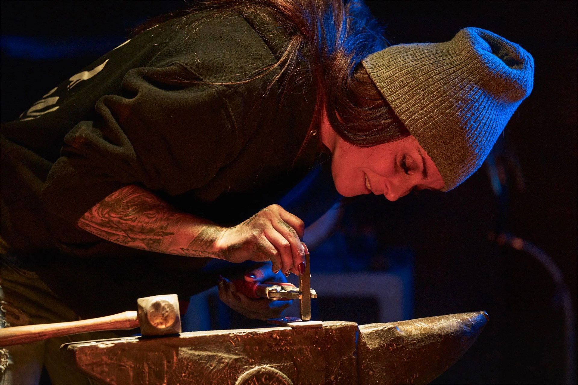 a woman making a knife