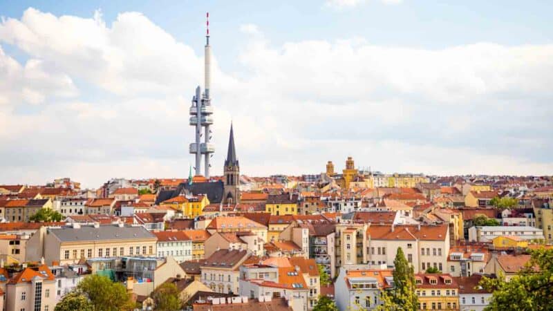 View from the top of the Vitkov Memorial on the Prague landscape on a sunny day with the famous Zizkov TV tower on the horizon.