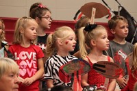 Elementary students in the stands at a pep rally