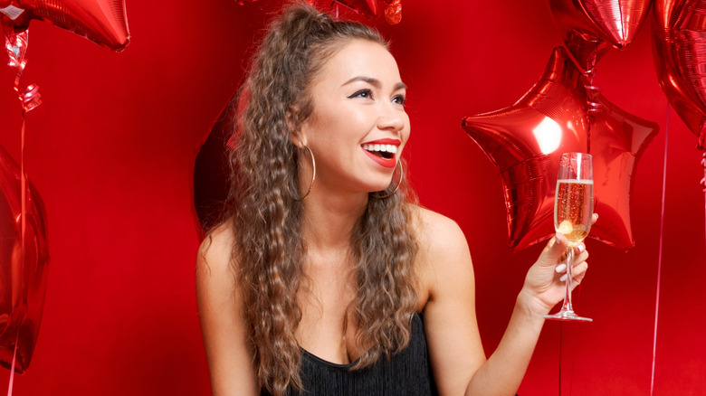 Woman with red lipstick and red balloons