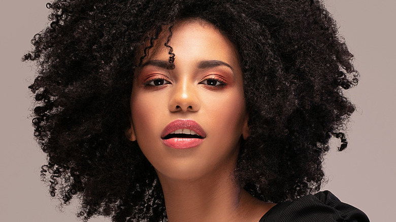 woman with dark curly afro hair