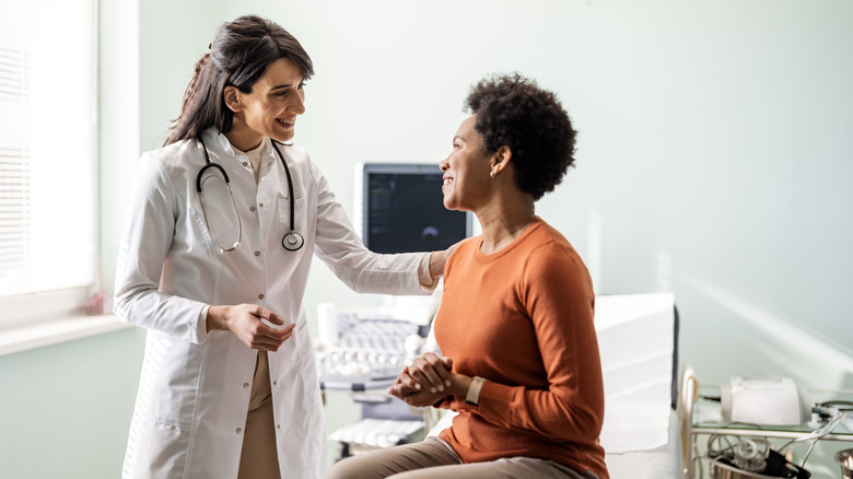 woman talking to doctor