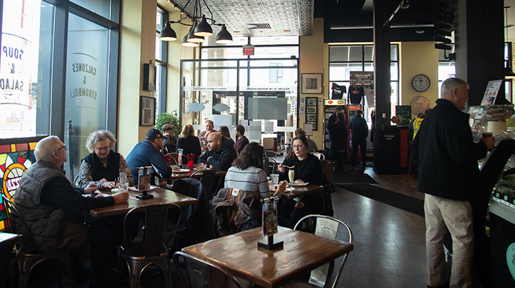 Busy pizzeria filled with customers