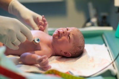 doctor checking baby out