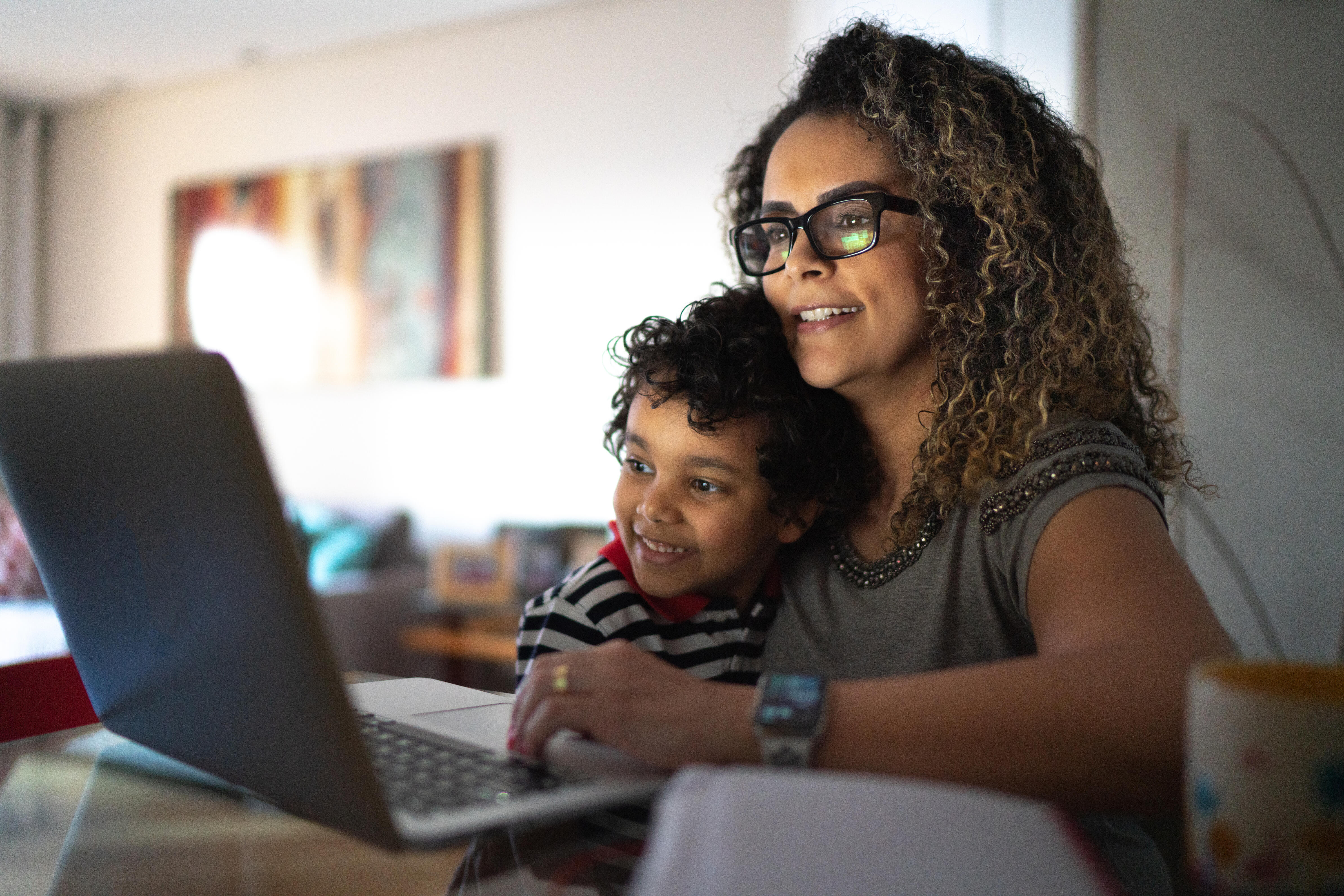 mother and son using a laptop