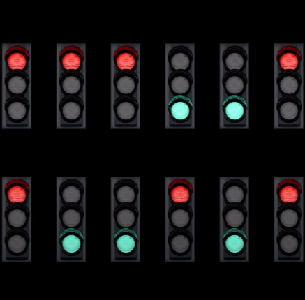 An array of stylized traffic stoplights against a black background