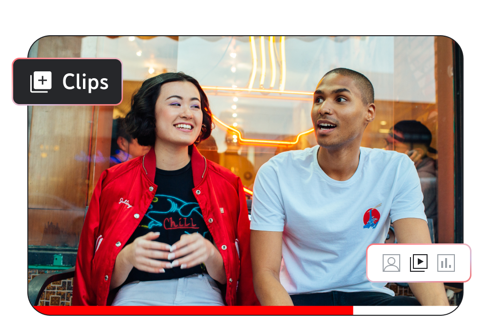 Image of two people sitting and talking outside of a restaurant with the word ‘Clips’ in the corner of the screen.