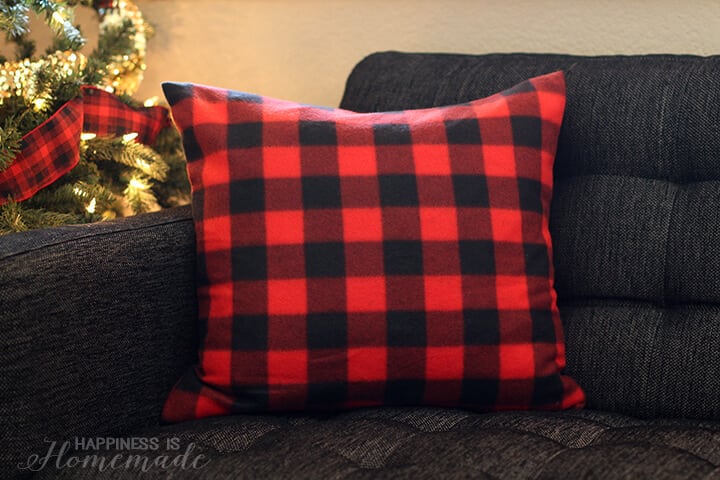 red buffalo check plaid pillow on couch