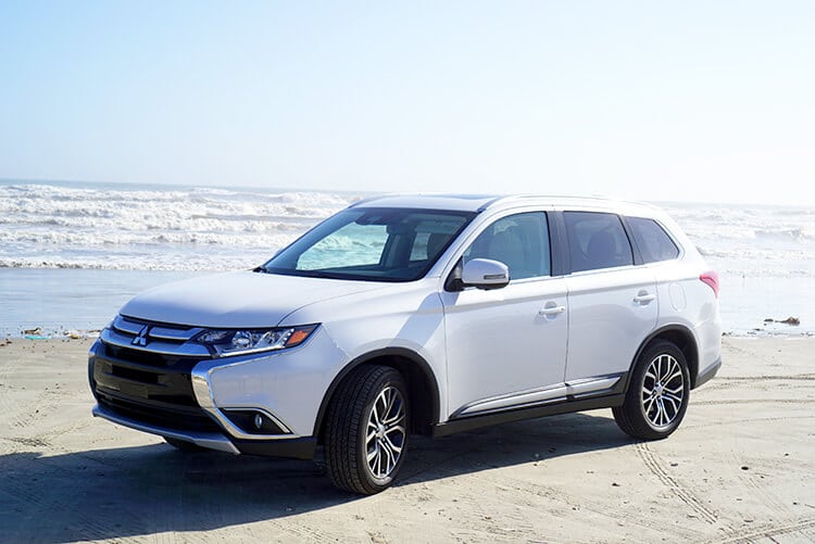 white Mitsubishi Outlander suv