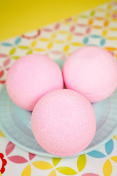 pink bath bombs on blue platter