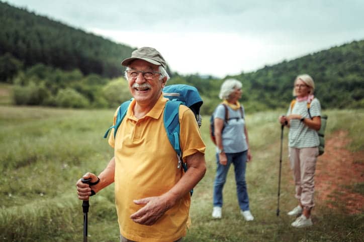 Three Seniors On A Hike Together During Spring.