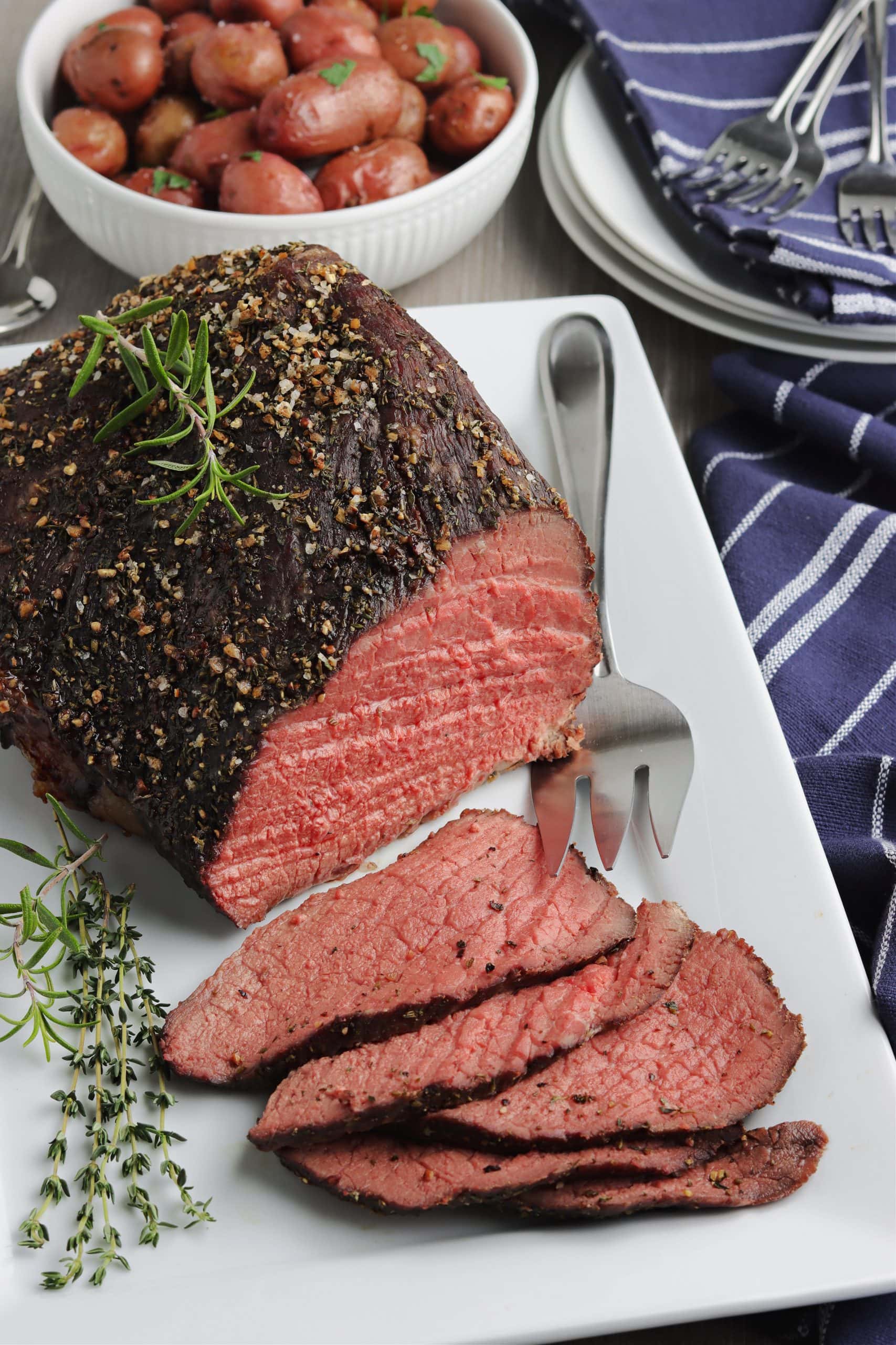 Roast beef on a serving platter.