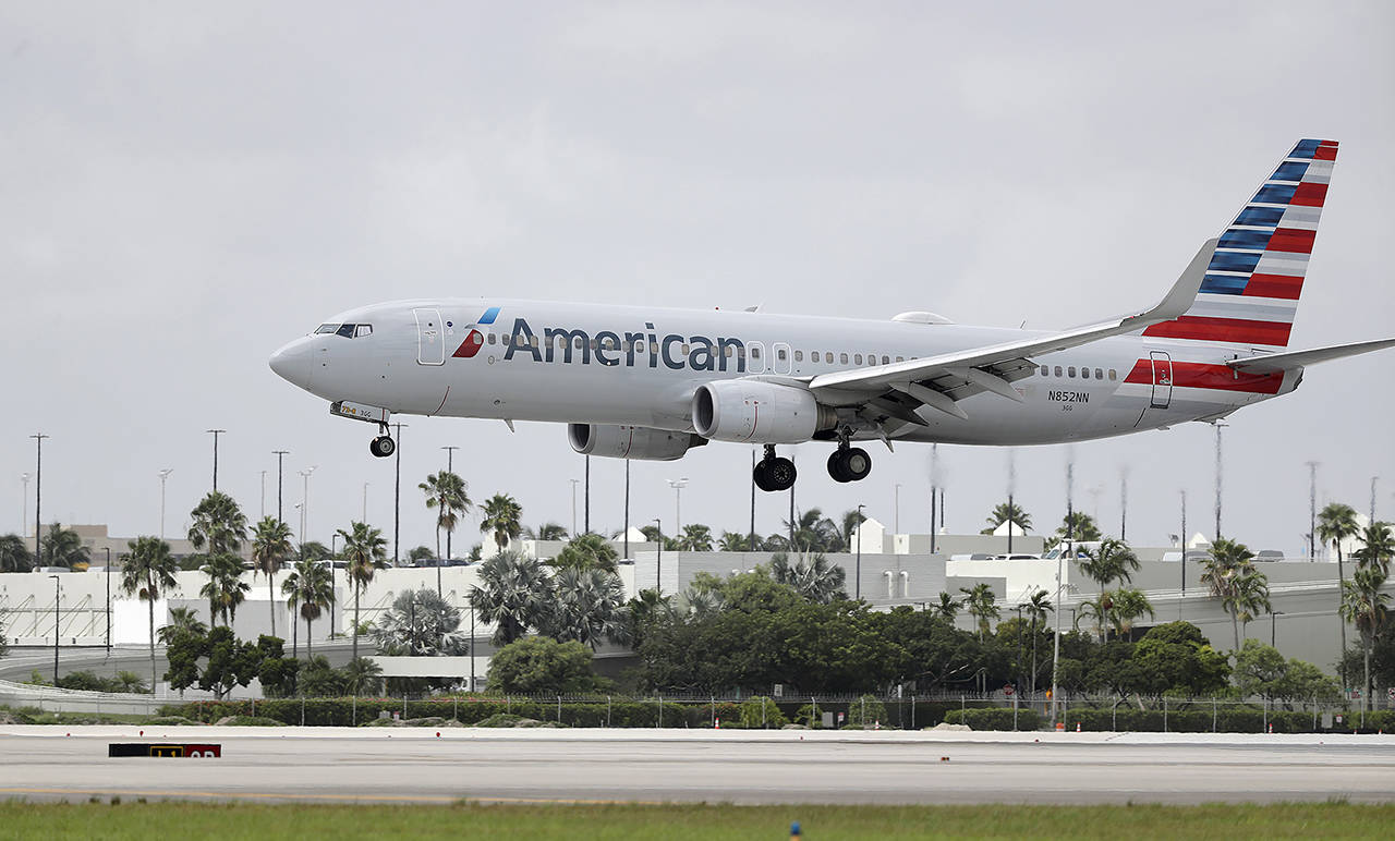 An American Airlines Boeing 737-823 lands at Miami International Airport on July 27 in Miami. (AP Photo/Wilfredo Lee, File)