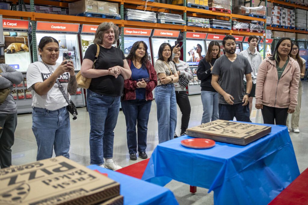 Friends and family sing “Happy Birthday” during a first birthday party at Costco in Lake Stevens on Friday, May 31, 2024. (Annie Barker / The Herald)
