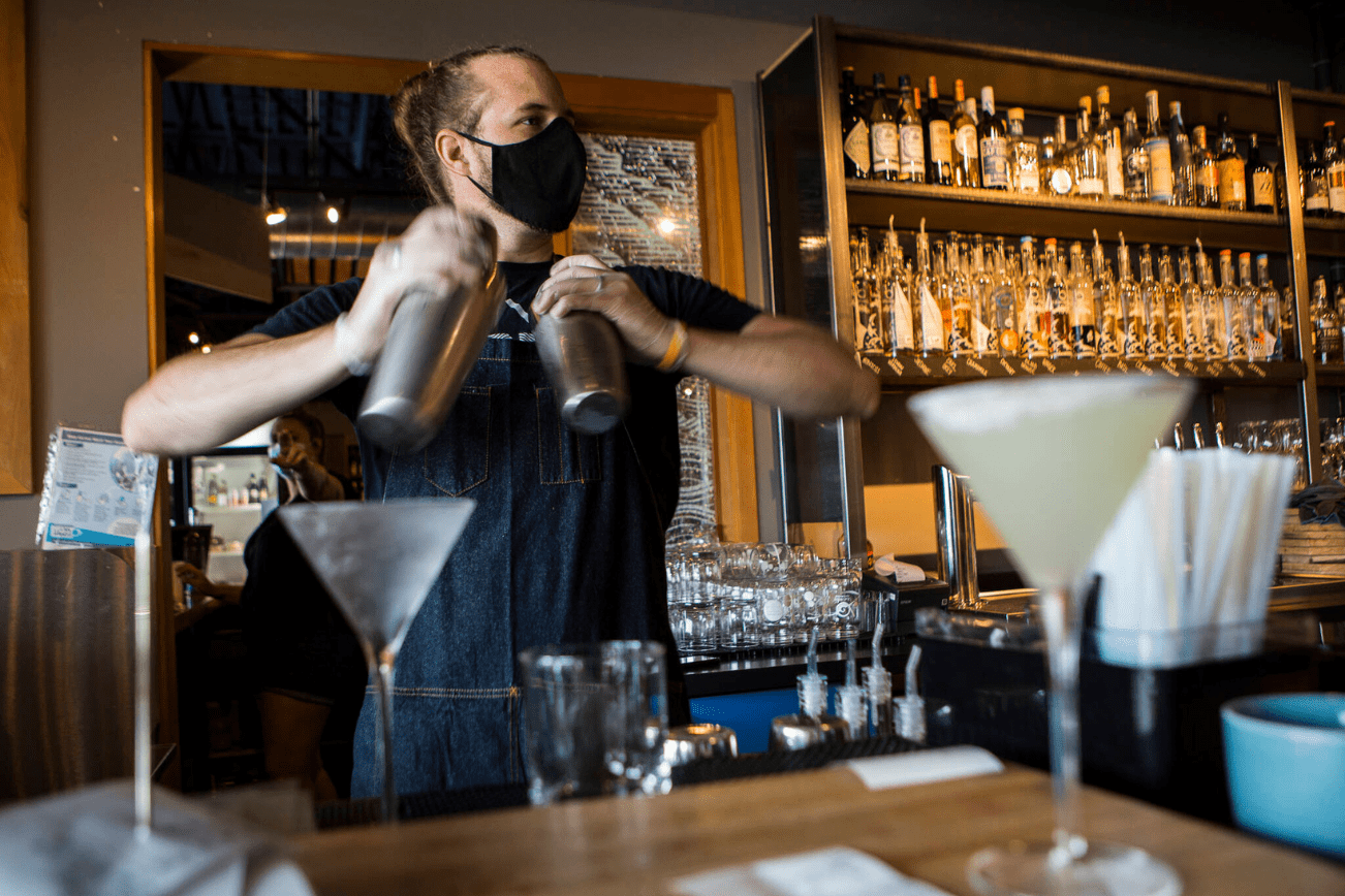 Kyle Galvin, who has worked for Bluewater for more than 4 years, makes cocktails on July 10, 2020 in Everett. (Olivia Vanni / The Herald)