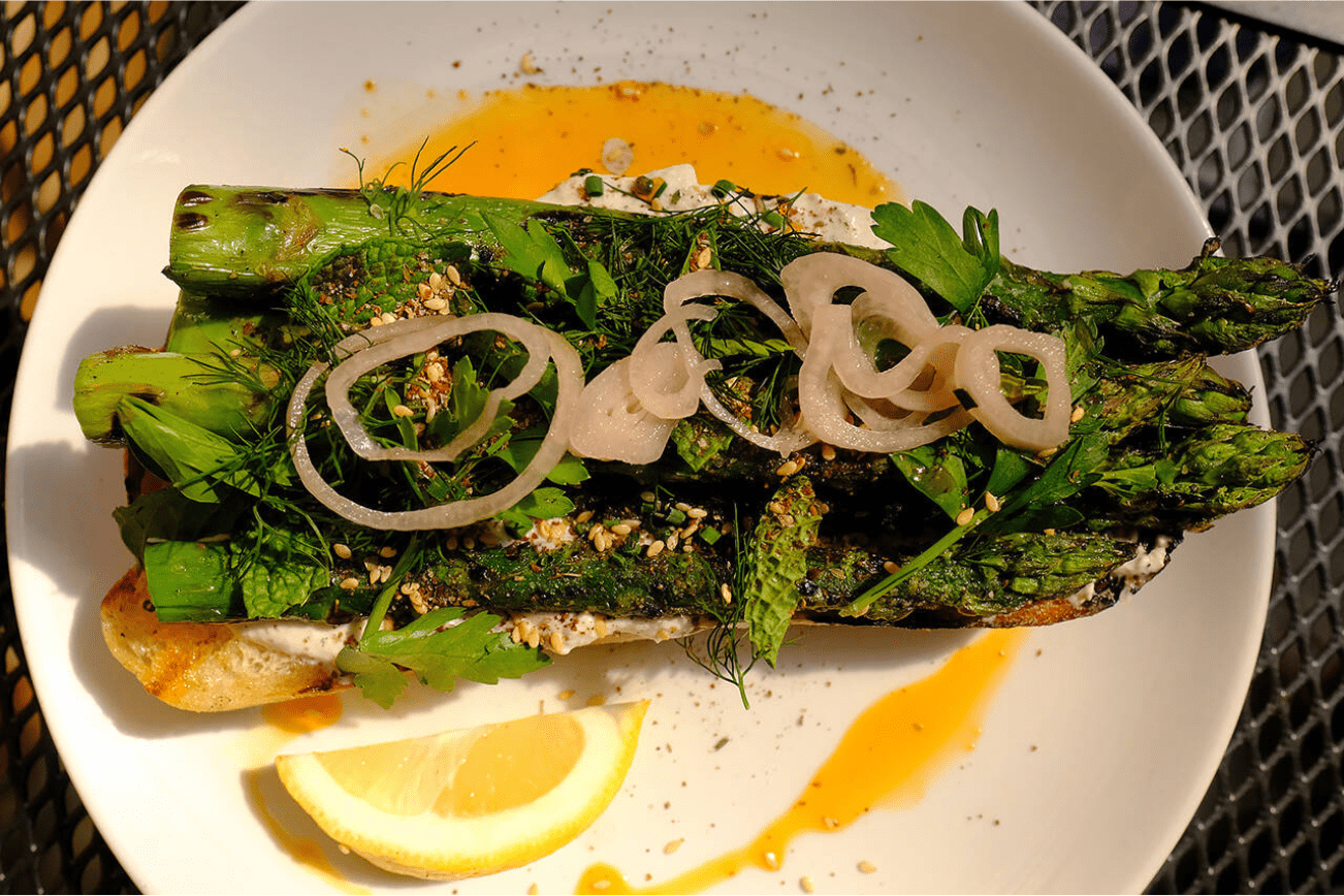 LJ’s Bistro in Lake Stevens serves up a steak knife-worthy asparagus toast ($14), with whipped feta, local asparagus, fresh herbs, za’atar and pickled shallot atop grilled bread. (Taylor Goebel / The Herald)