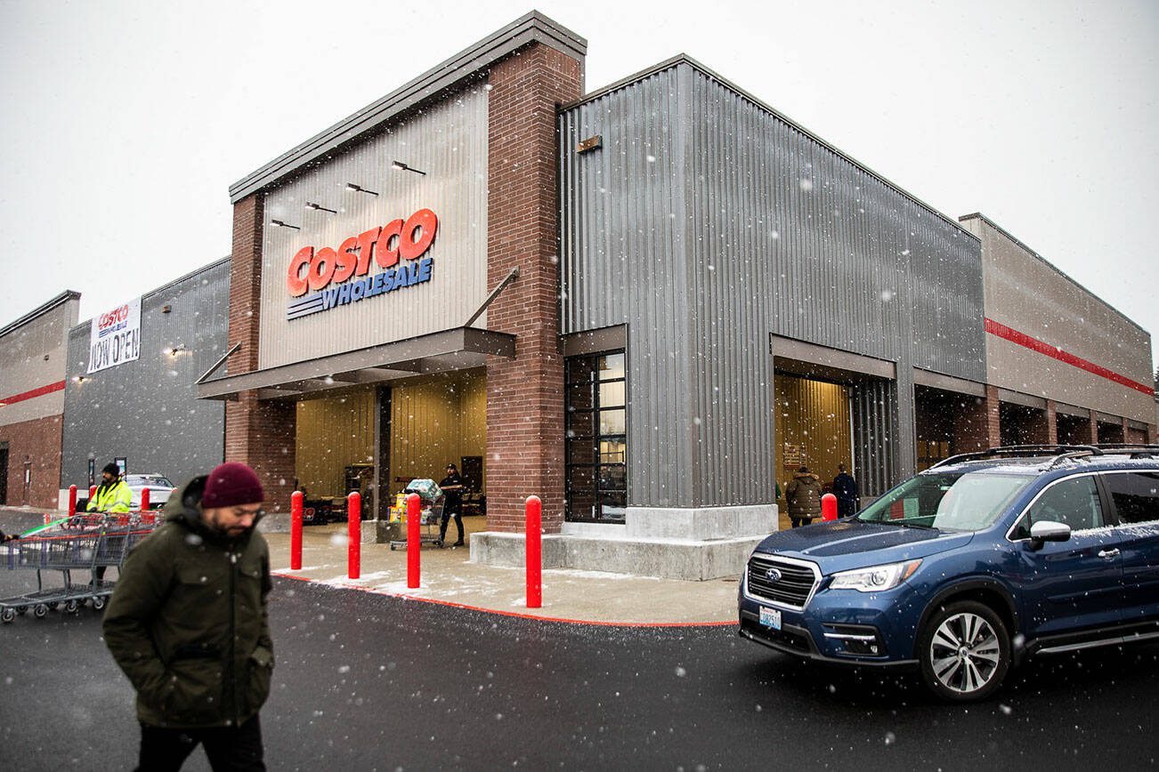 Customers enter and exit the Costco on Dec. 2, 2022, in Lake Stevens. (Olivia Vanni / The Herald)