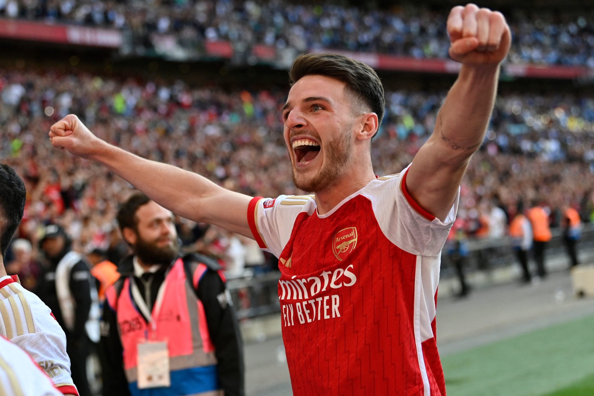 Arsenal's English midfielder Declan Rice celebrates after Arsenal win the penalty shoot-out after the English FA Community Shield football match be...