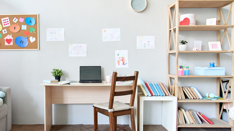 wooden bookshelf next to desk