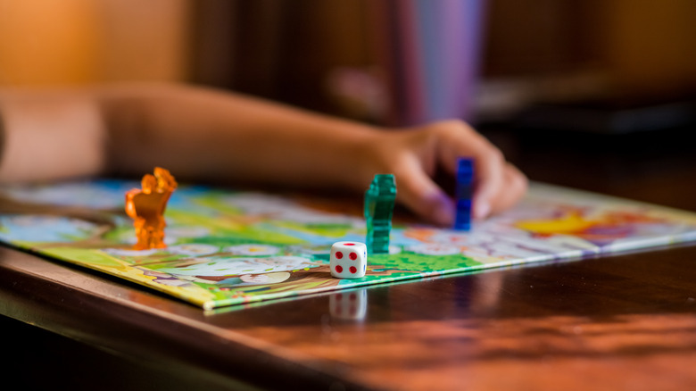 child playing a board game