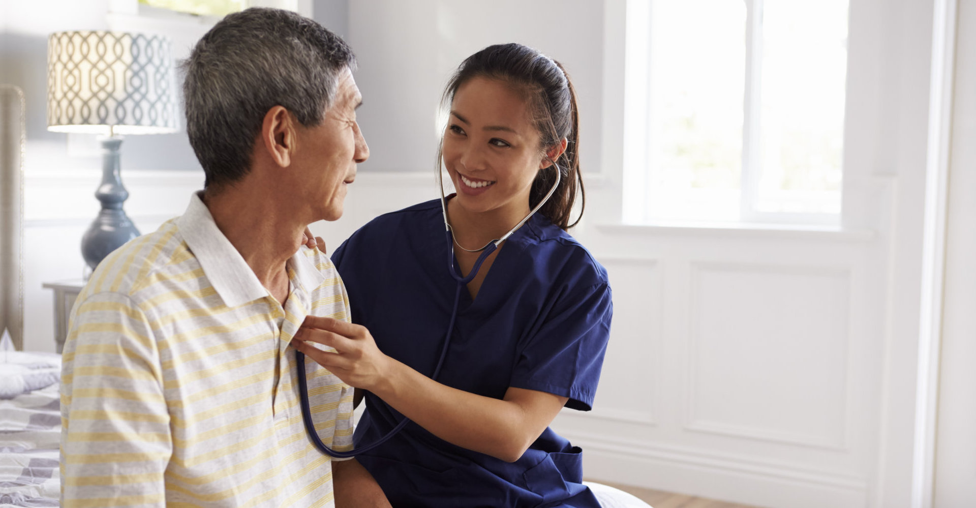 Nurse Making Home Visit To Senior Man For Medical Exam