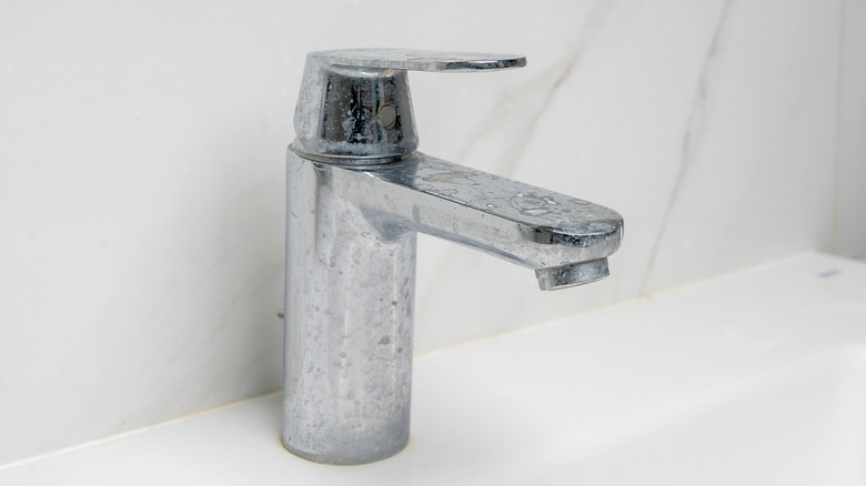 limescale residue on a faucet