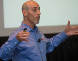 An instructor gestures during an education session