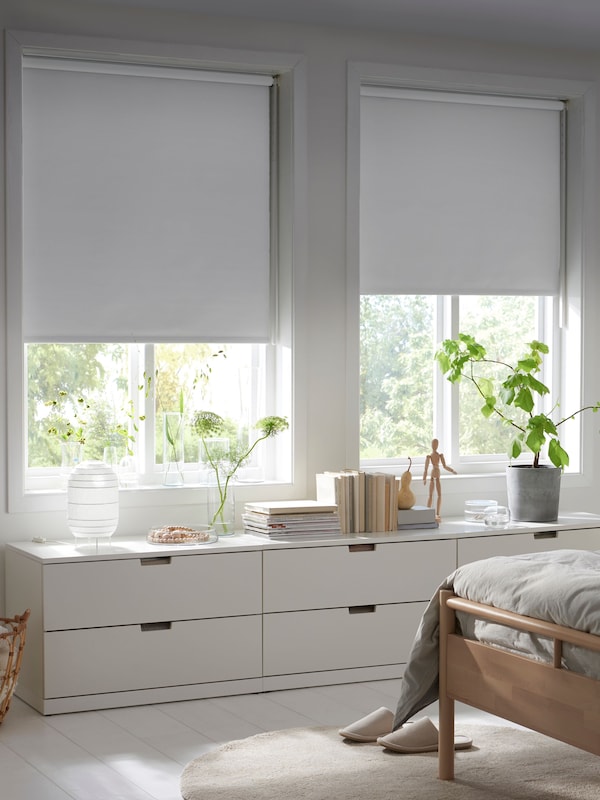 A white FRIDANS block-out roller blind