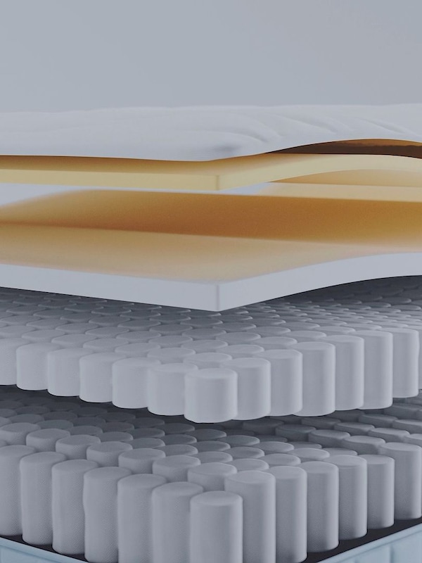 Close-up of the different layers of material inside a mattress, to explain how it’s constructed for maximum comfort.