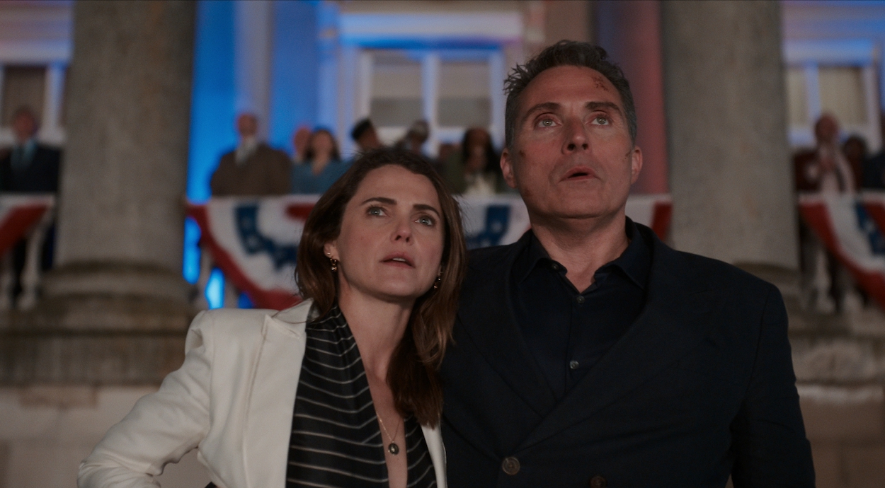 The Diplomat Season 2 stars Keri Russell as Kate Wyler and Rufus Sewell as Hal Wyler, shown here watching fireworks on the 4th of July