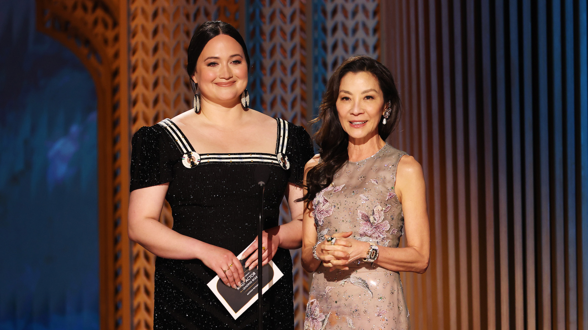 Lily Gladstone and Michelle Yeoh speaking onstage during the 31st Annual Screen Actors Guild Awards