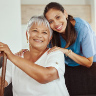 caregiver and her patient smiling