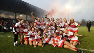 <p>CHAMPIONS: Naomh Treasa players celebrate with the cup. Picture: ©INPHO/Bryan Keane</p>