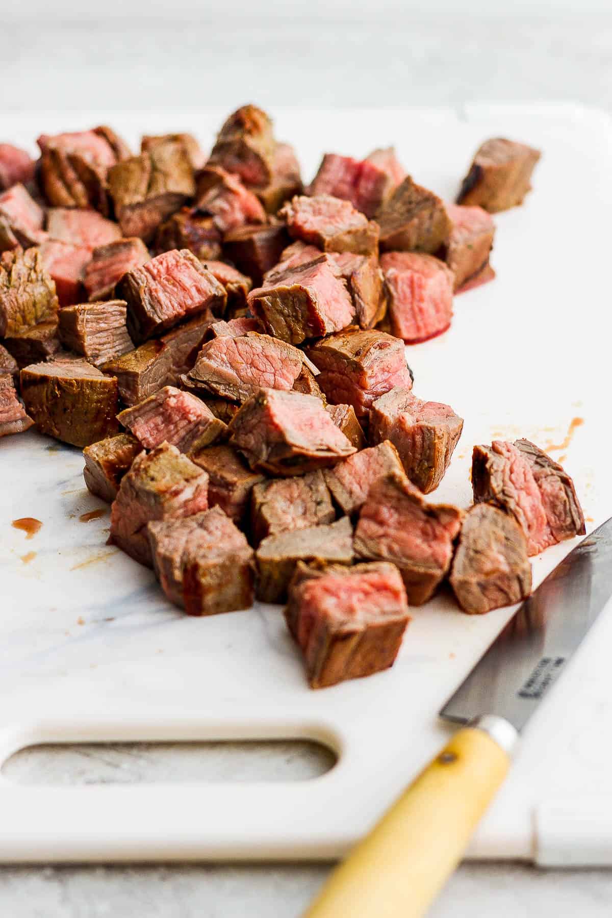 Carne asada cooked and sliced into small bite sixed pieces. 