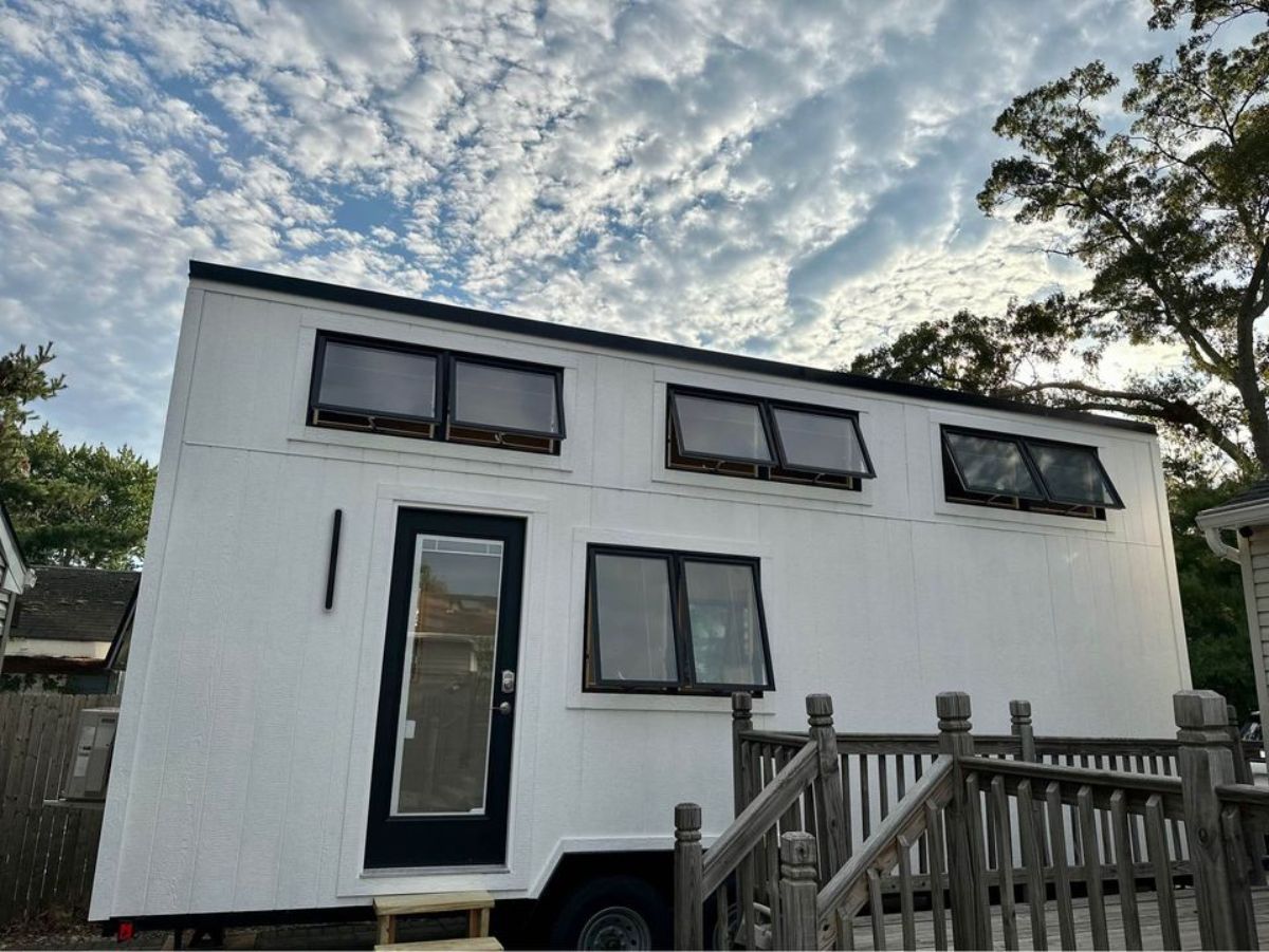 main entrance and stunning exterior of two lofts tiny house