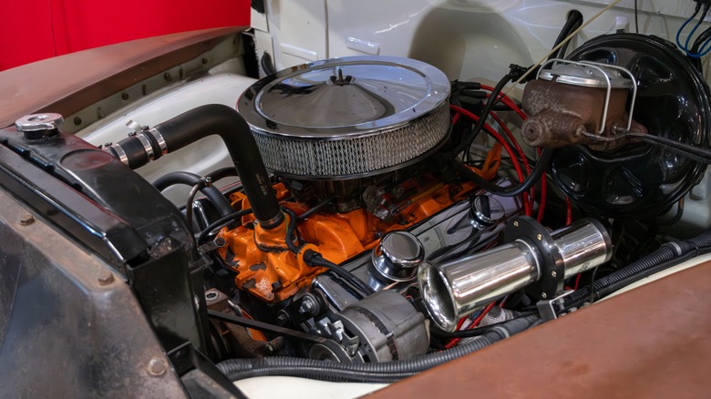 An old engine in a hot rod.