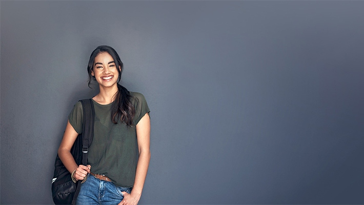 A girl standing and smiling