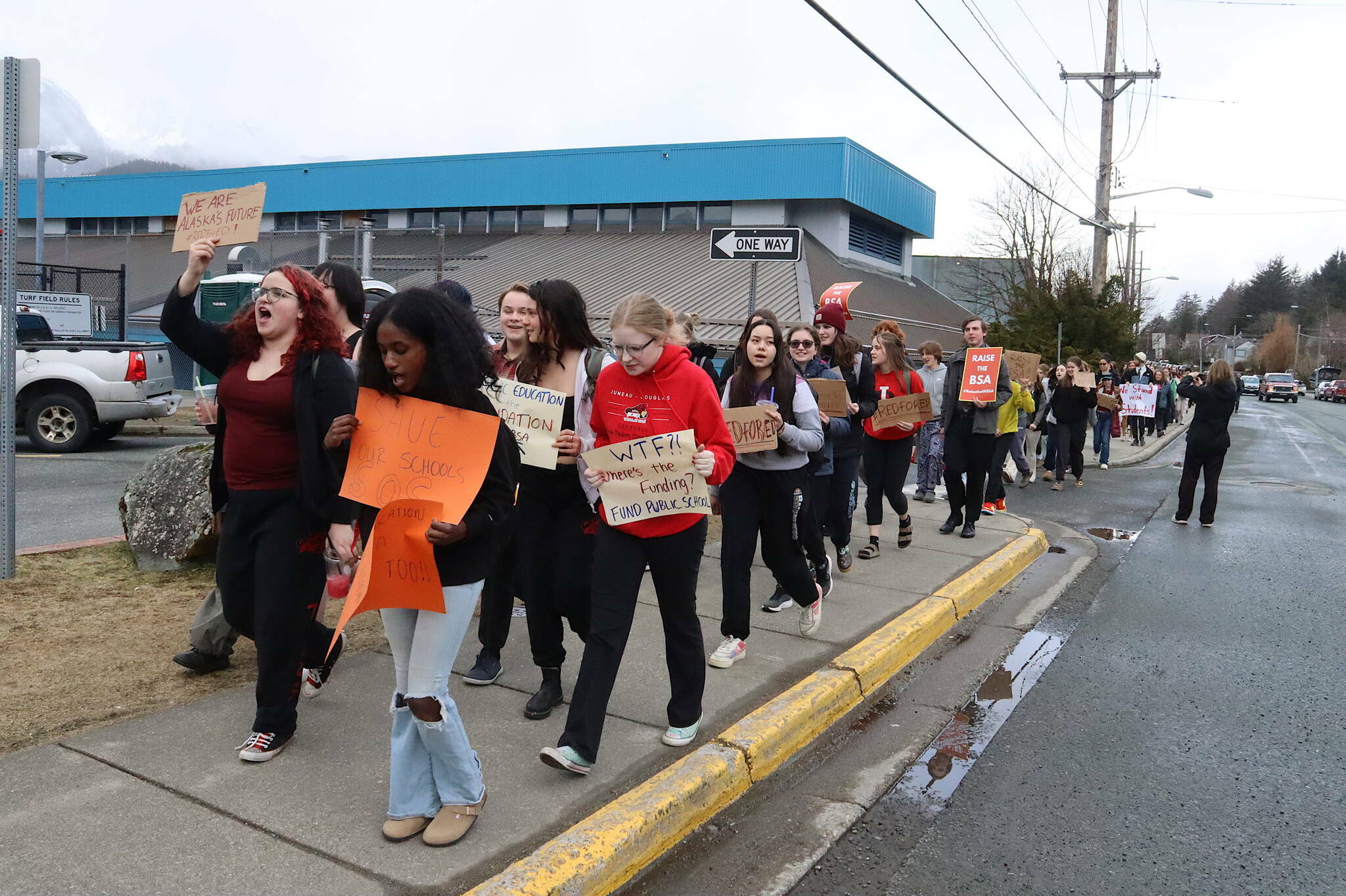 Juneau-Douglas High School: Yadaa.at Kalé students, along with a handful of state legislators and staff members, march from the school to the Alaska State Capitol on Thursday, April 4, 2024, in a protest seeking more state funding from lawmakers. (Mark Sabbatini / Juneau Empire file photo)