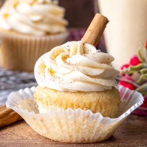 Eggnog cupcake with a glass of eggnog